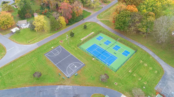 a view of a pool an outdoor space and seating area