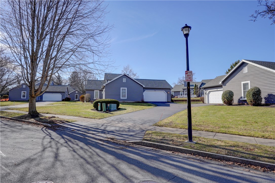 65 Cloverdale Street Rochester, NY 14612 - Photo 2 of 50 street lights and sidewalks provide the walkable p