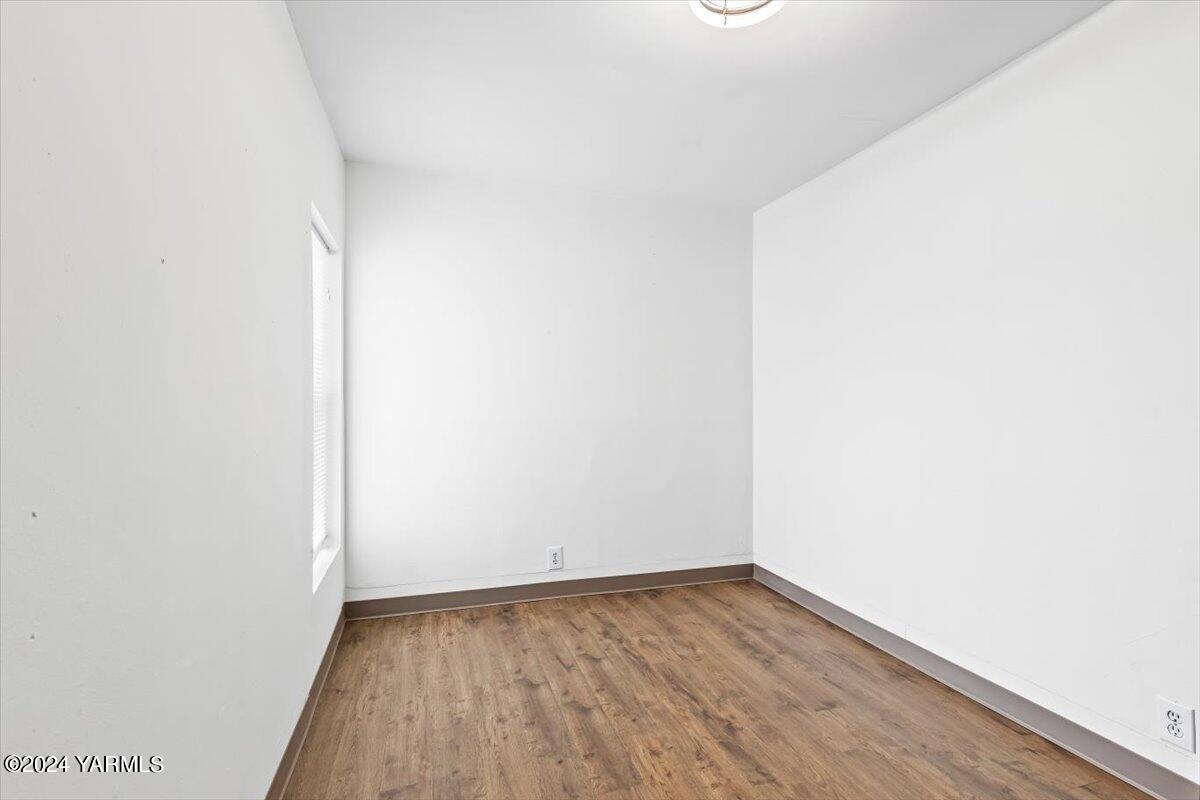 710 East Walnut Street Yakima, WA 98901 - Photo 7 of 15 a view of a small space with wooden floor and a window