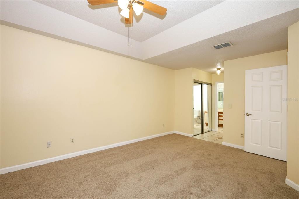 5405 Rutland Court Orlando, FL 32812 - Photo 12 of 33 an empty room with a empty space and a ceiling fan