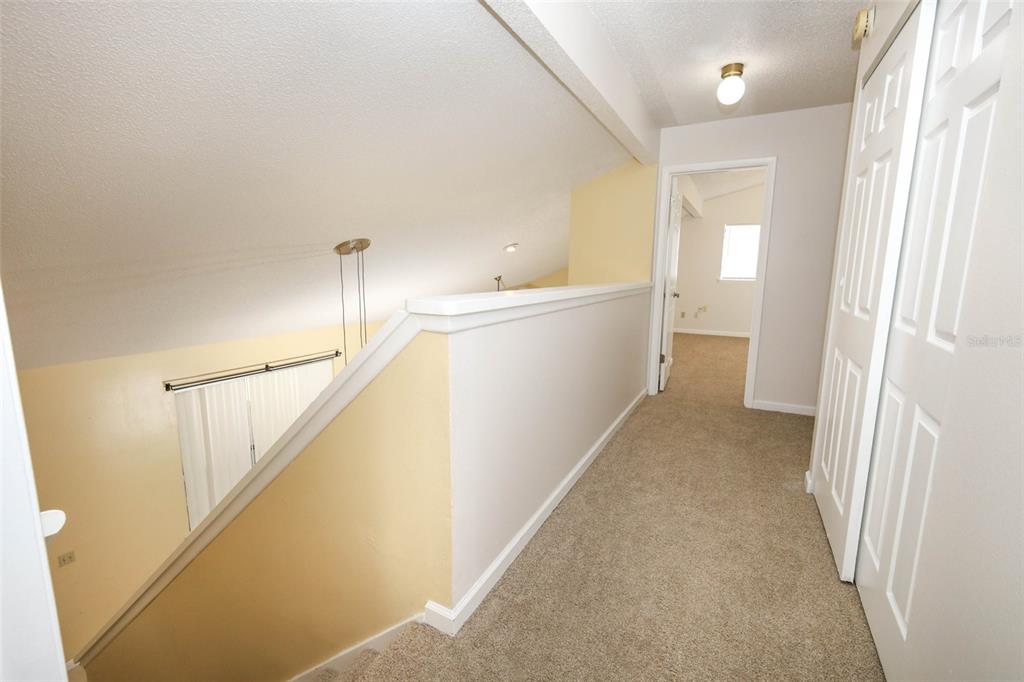 5405 Rutland Court Orlando, FL 32812 - Photo 15 of 33 a view of a hallway with closet and bathroom