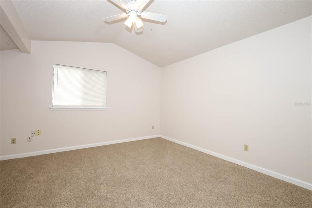 5405 Rutland Court Orlando, FL 32812 - Photo 16 of 33 an empty room with a window and a fan