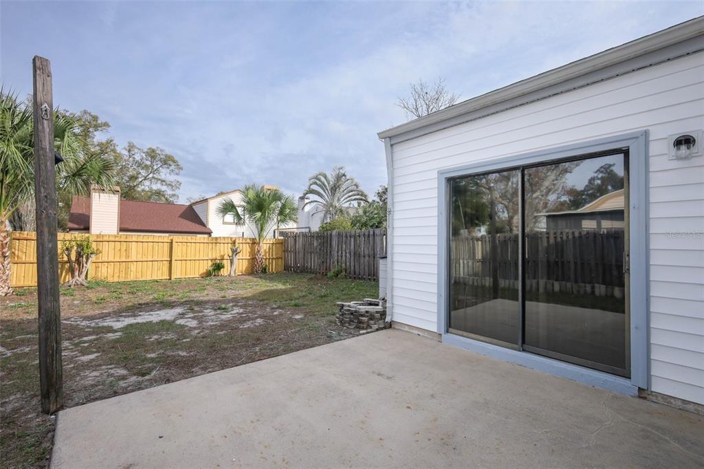 5405 Rutland Court Orlando, FL 32812 - Photo 22 of 33 a view of a house with a yard and potted plants