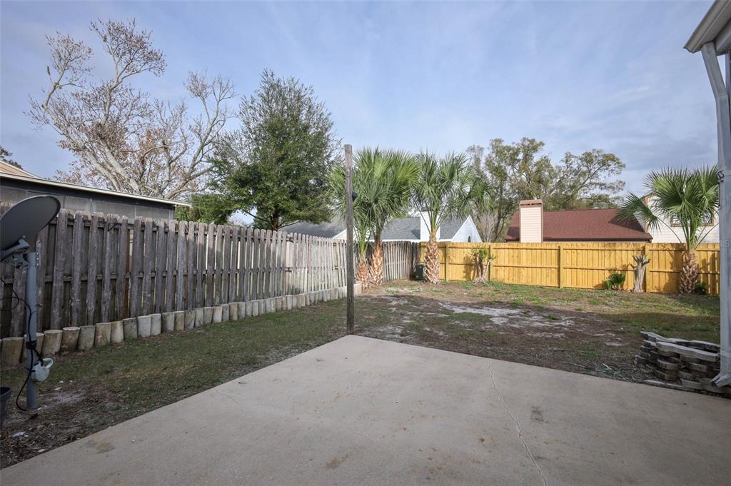 5405 Rutland Court Orlando, FL 32812 - Photo 23 of 33 a view of a backyard with a tree