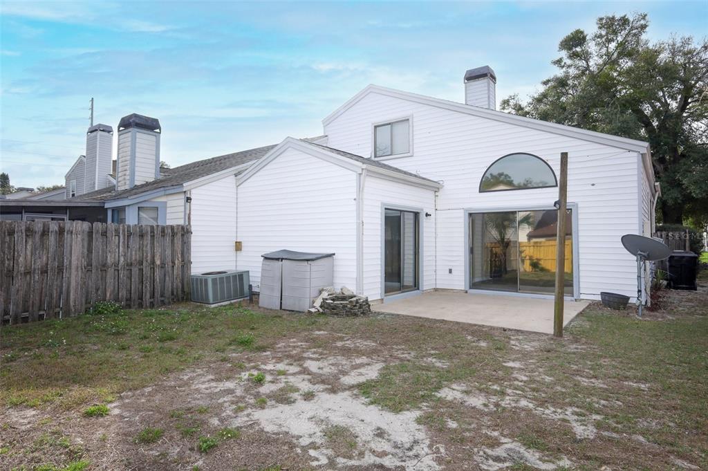 5405 Rutland Court Orlando, FL 32812 - Photo 24 of 33 a front view of a house with a garden
