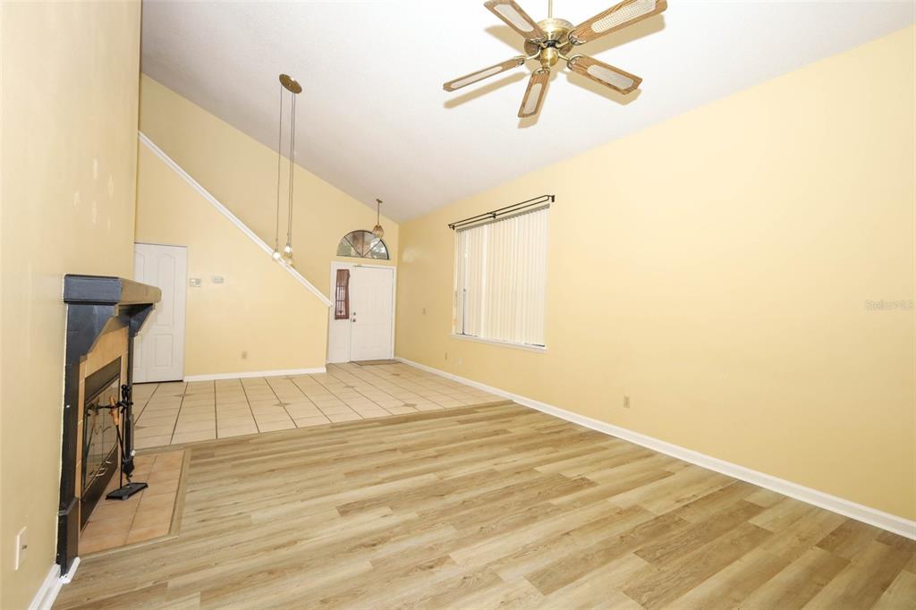 5405 Rutland Court Orlando, FL 32812 - Photo 4 of 33 a view of a room with wooden floor and white walls