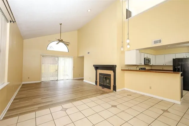a view of a kitchen with furniture and a fireplace