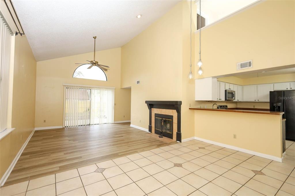 5405 Rutland Court Orlando, FL 32812 - Photo 6 of 33 a view of a kitchen with furniture and a fireplace