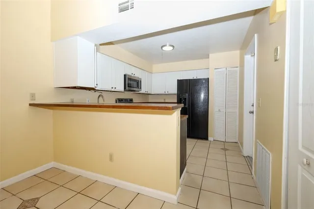 a view of a kitchen with a sink