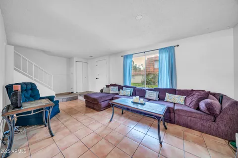 a kitchen with stainless steel appliances kitchen island granite countertop a refrigerator and a sink