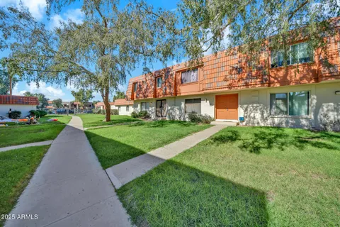 a view of a kitchen with stainless steel appliances and cabinets