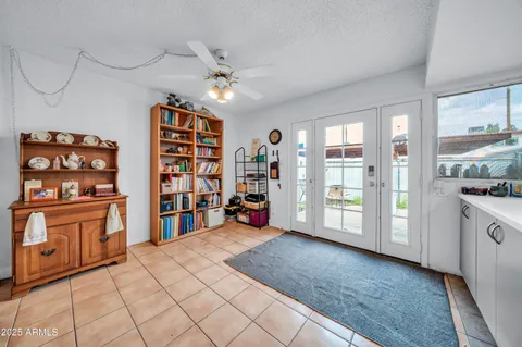 a kitchen with a sink refrigerator and cabinets