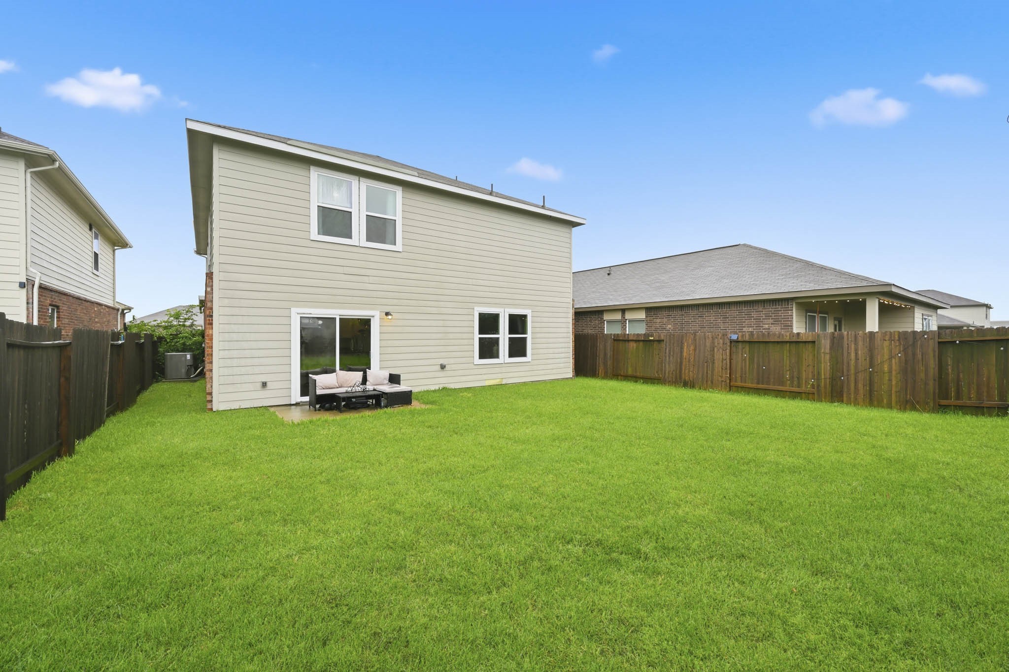 7207 Evitale Way Houston, TX 77049 - Photo 40 of 43 a backyard of a house with table and chairs