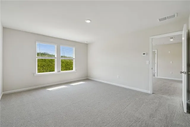 a view of room with wooden floor