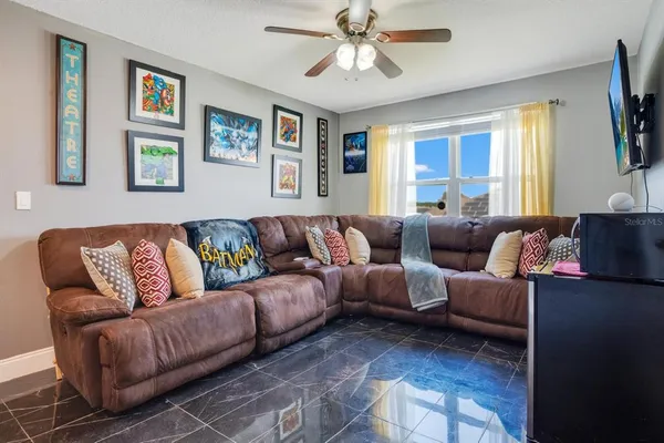 a living room with furniture and a window