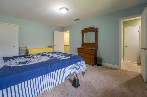 a bedroom with a bed and a cabinets
