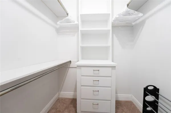 a view of a patio with a table chairs and a couple of chairs