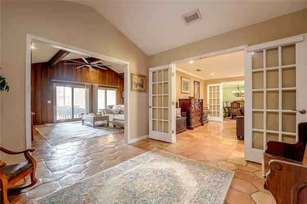 a view of a livingroom with furniture and a large window