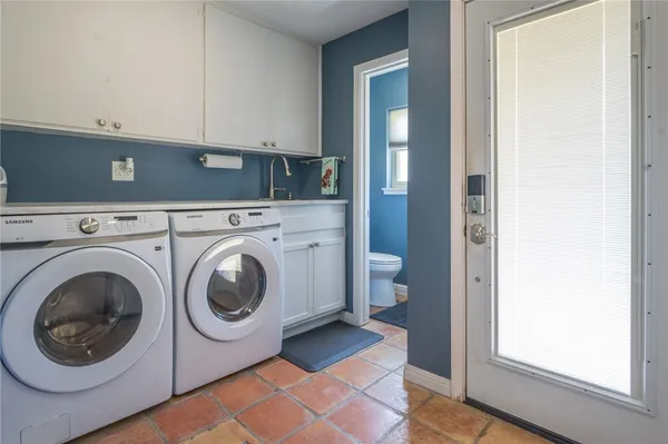 a utility room with dryer and washer