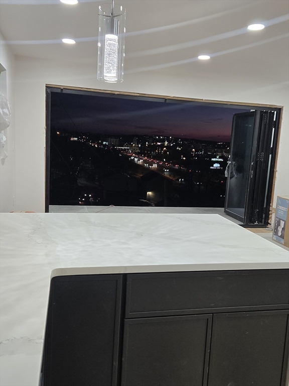 47 Laurel Street, Unit 47 Worcester, MA 01605 - Photo 2 of 23 a bathroom with a sink a vanity and a mirror