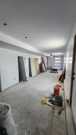 a bedroom with a bed and gym equipment