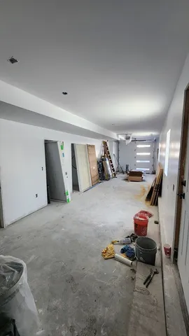 a bedroom with a bed and gym equipment