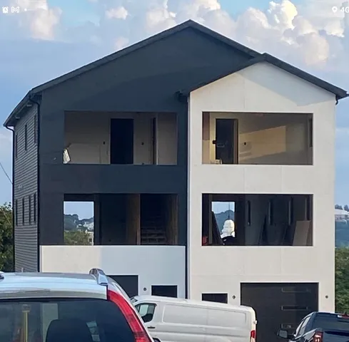 a view of house with a street