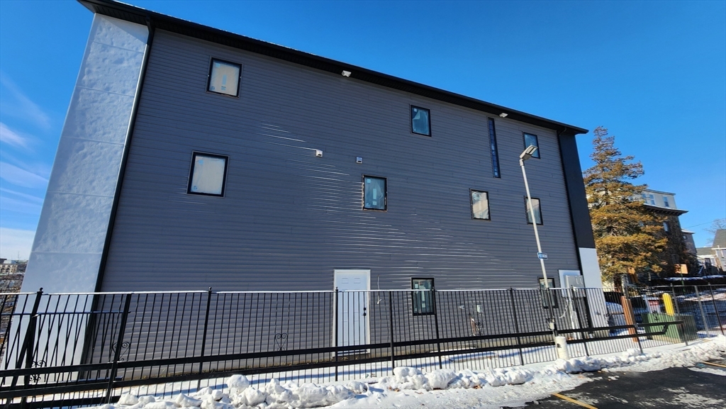 47 Laurel Street, Unit 47 Worcester, MA 01605 - Photo 6 of 23 a view of a brick wall of the building