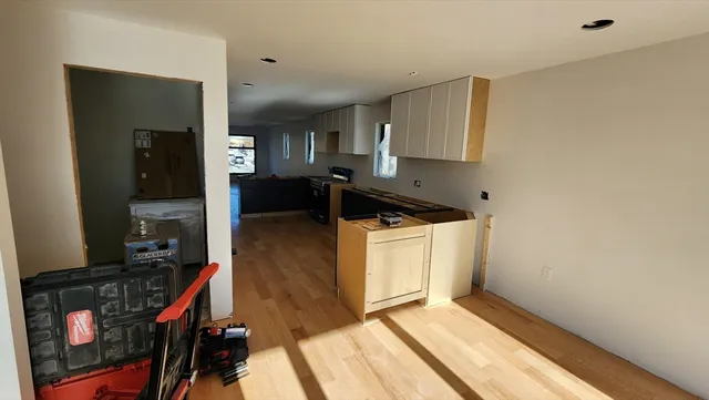 a kitchen with a sink and cabinets