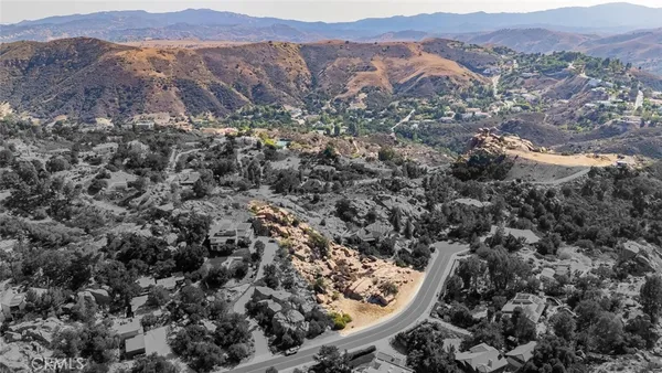 an aerial view of mountain and trees