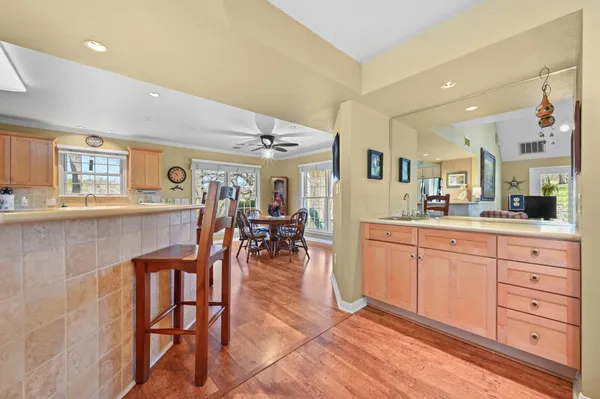 a bedroom with bed and wooden floor