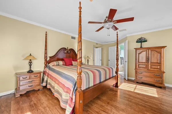 a living room with furniture a rug and a floor to ceiling window