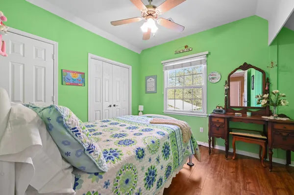 a view of a yard with a large tree