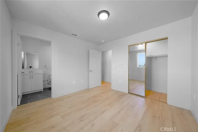 a view of a kitchen with a sink stove and cabinets