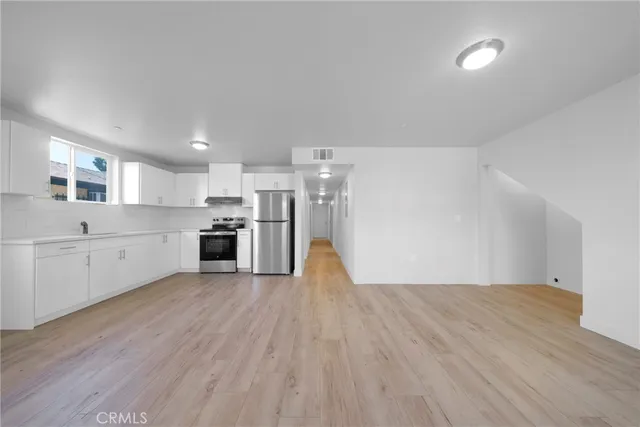 a bathroom with a sink toilet a mirror and shower