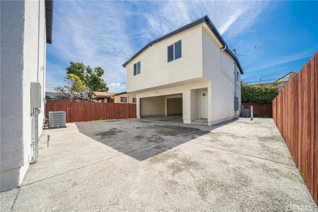 a view of a hallway with wooden floor and closet