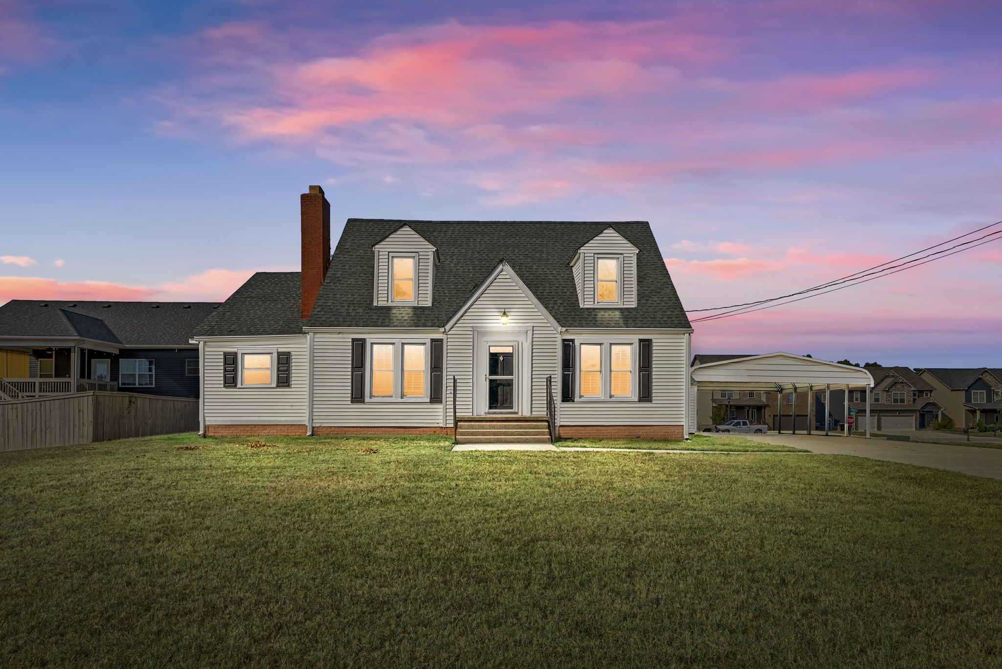 a front view of a house with a yard