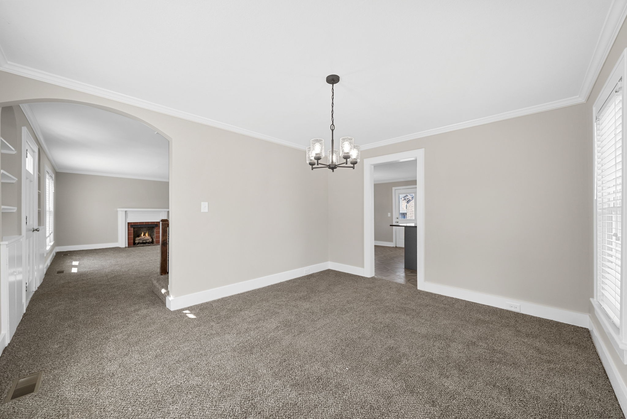 2021 Powell Road Clarksville, TN 37043 - Photo 13 of 31 a view of empty room with a chandelier fan and windows