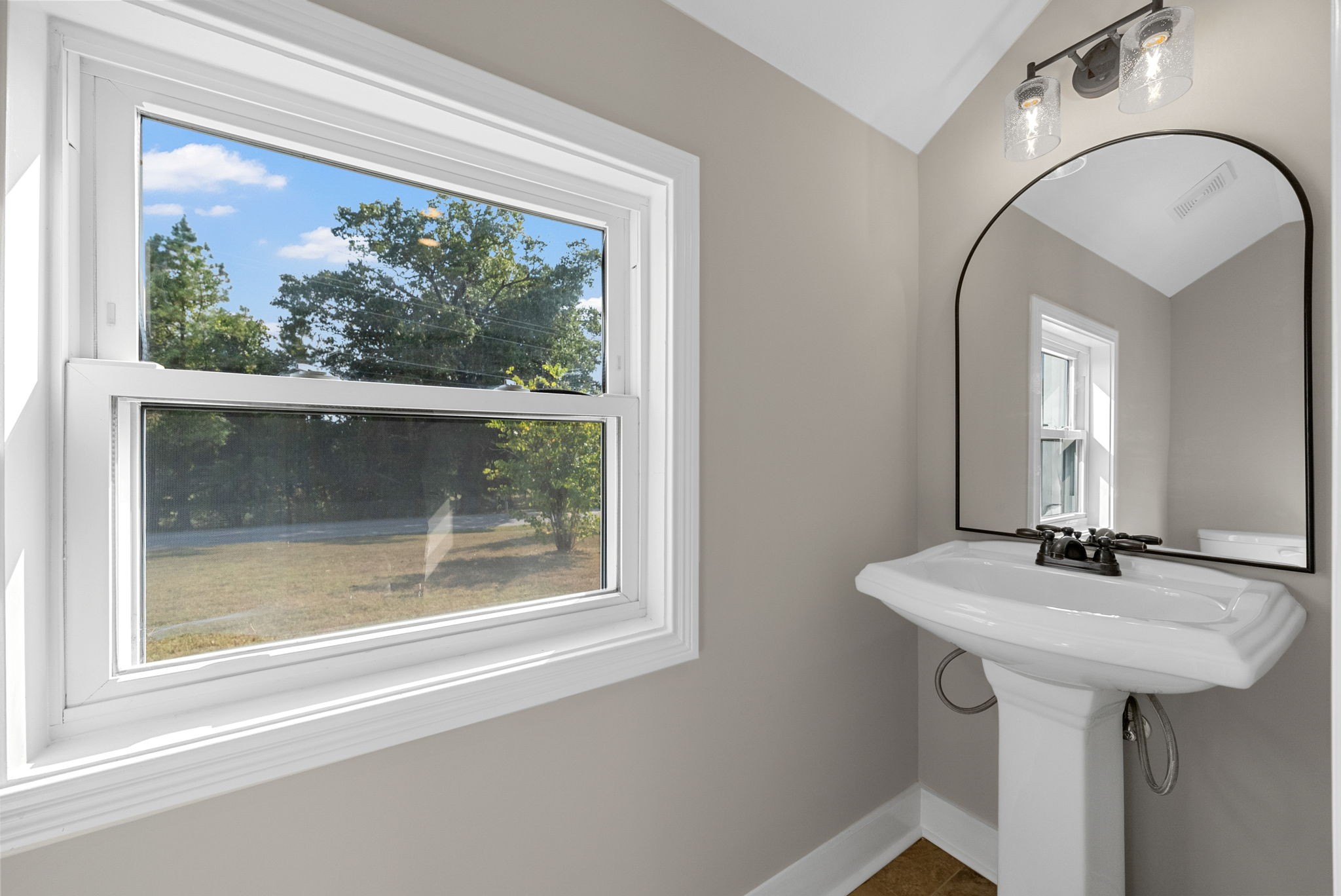2021 Powell Road Clarksville, TN 37043 - Photo 15 of 31 a bathroom with a sink and a mirror