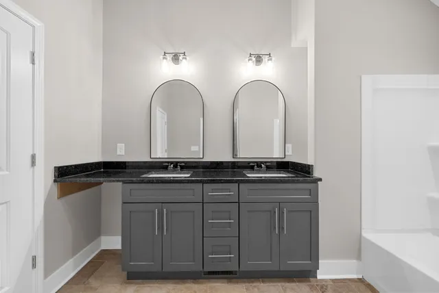 a bathroom with a tub and shower