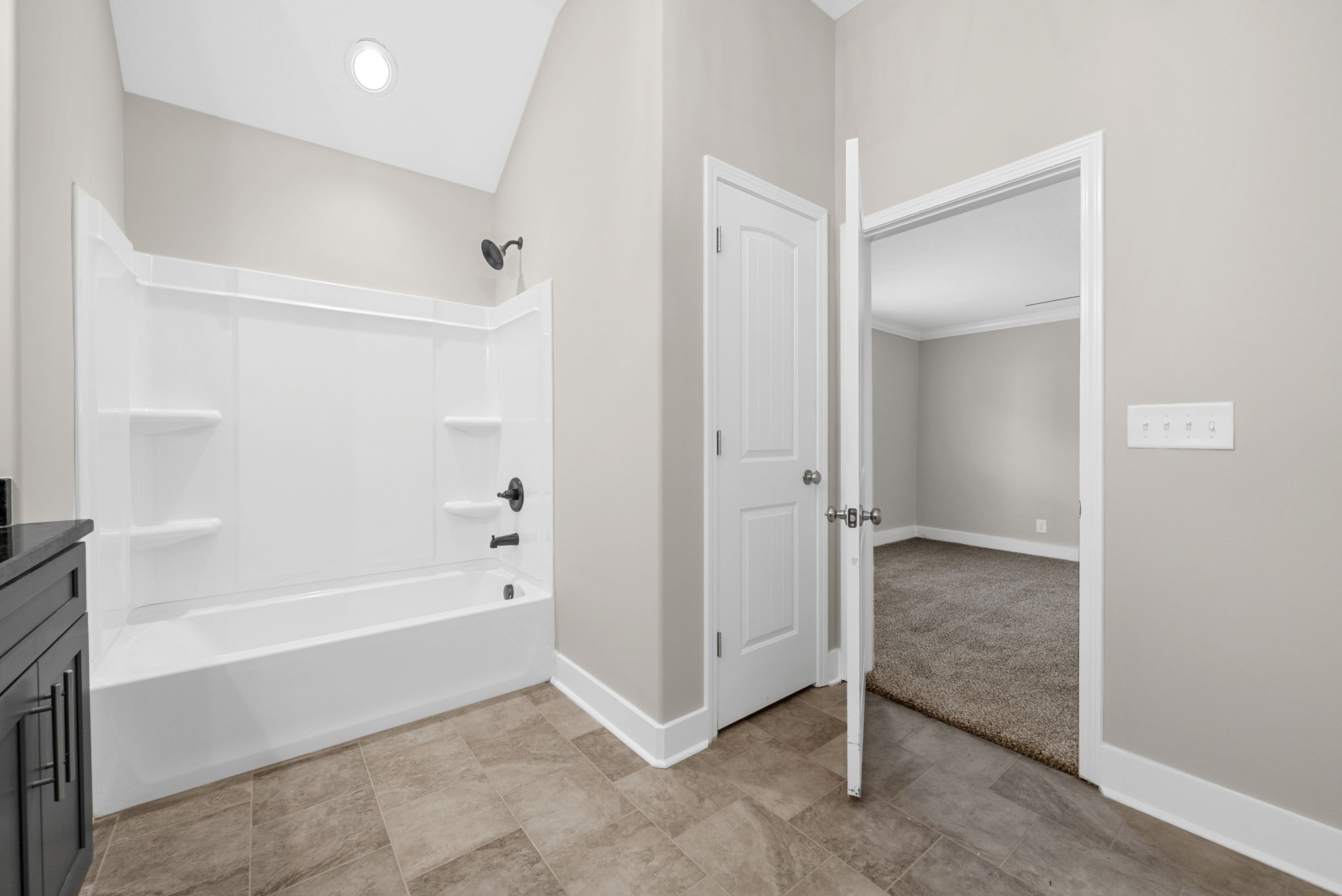 2021 Powell Road Clarksville, TN 37043 - Photo 18 of 31 a bathroom with a tub and shower