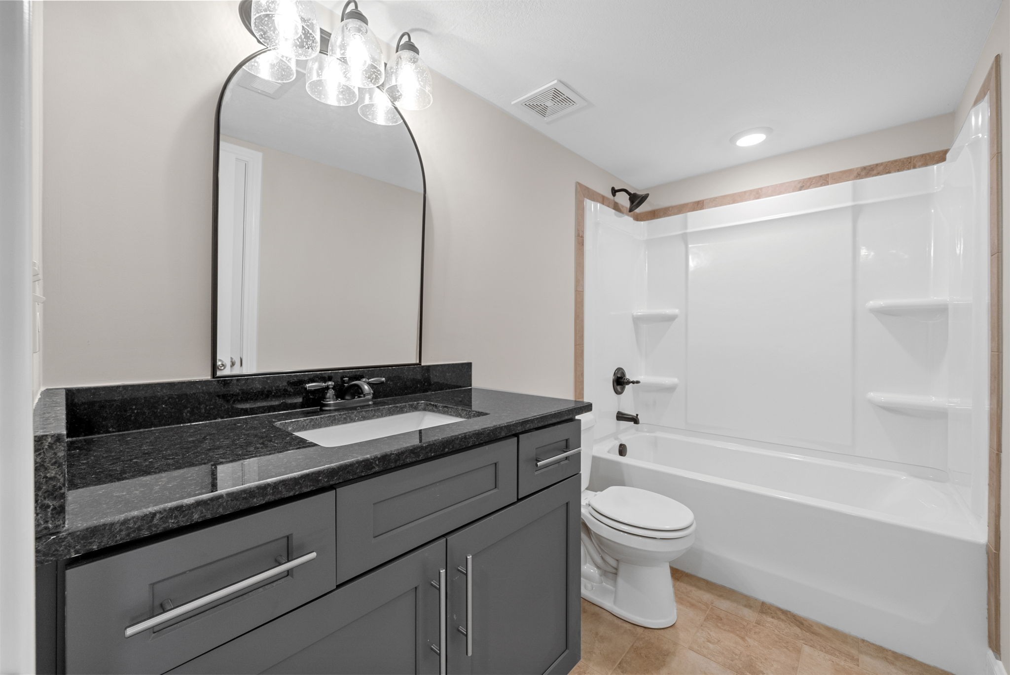 2021 Powell Road Clarksville, TN 37043 - Photo 22 of 31 a bathroom with a granite countertop sink a toilet and bathtub