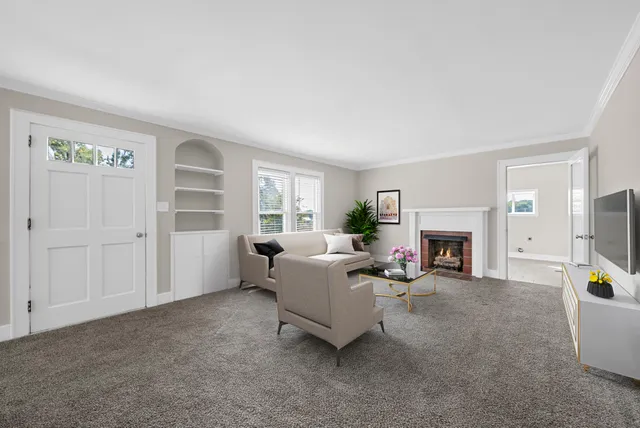 a living room with furniture and a fireplace