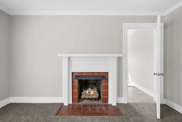a living room with a fireplace