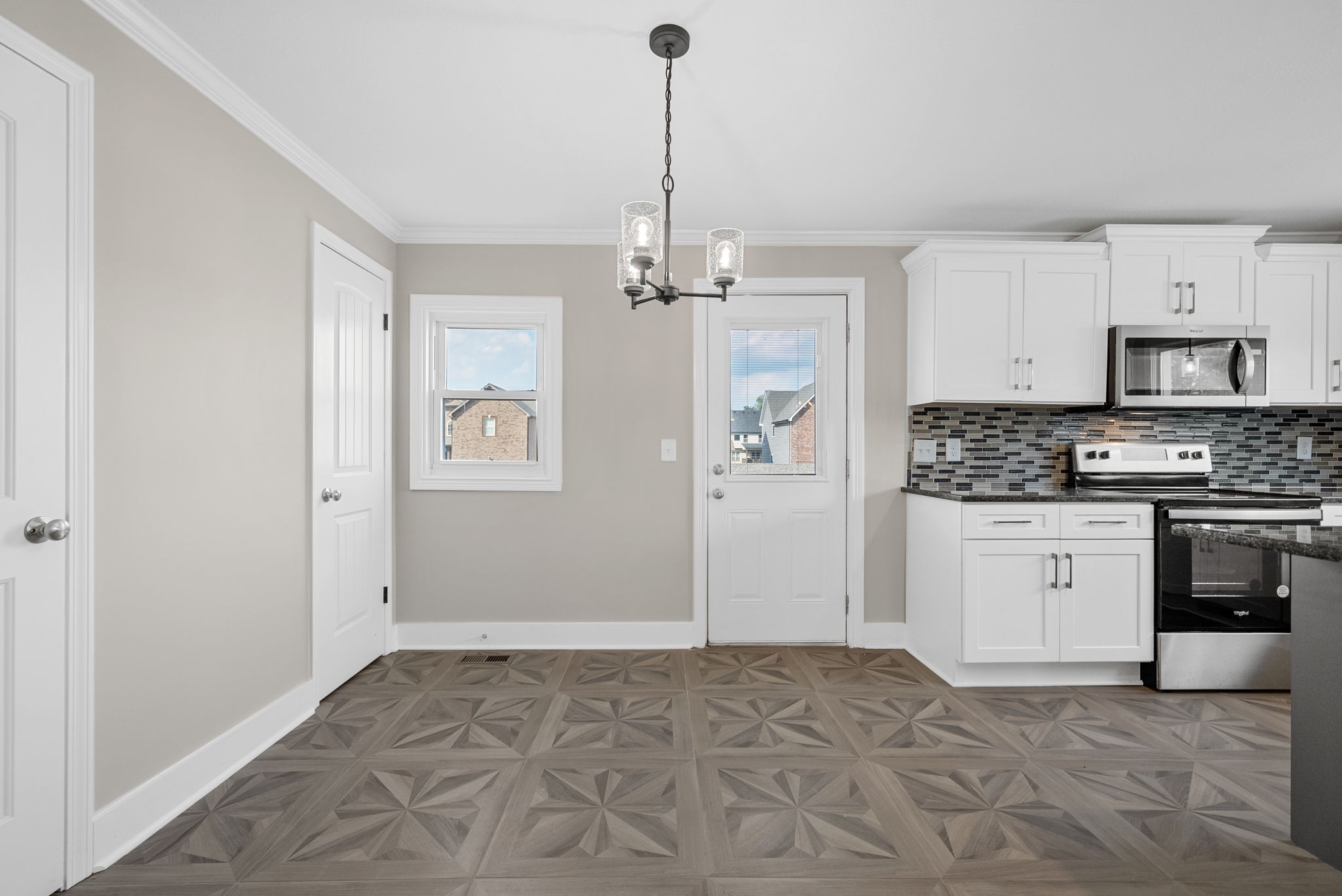 2021 Powell Road Clarksville, TN 37043 - Photo 6 of 31 a kitchen with granite countertop a stove a sink and a refrigerator