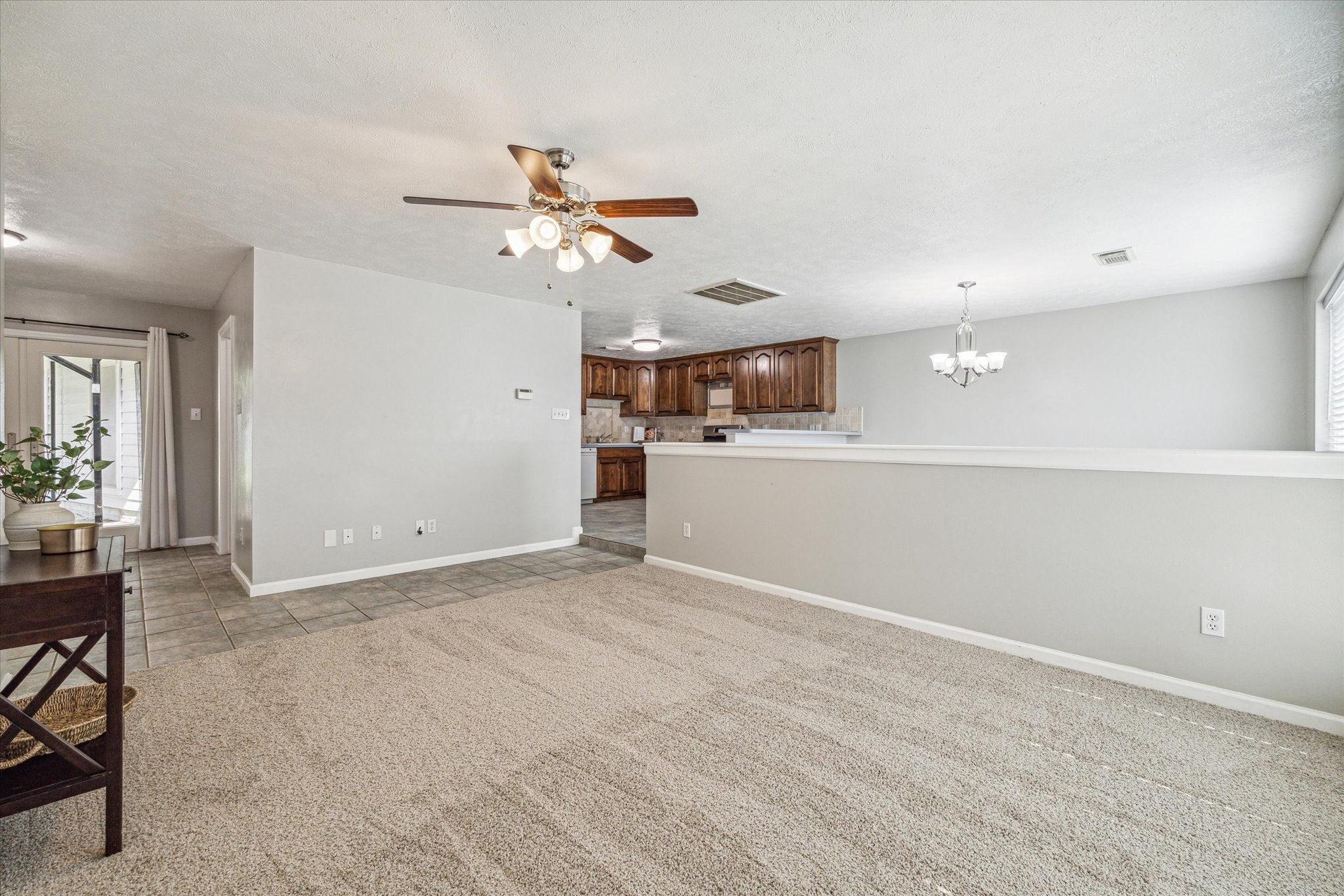 3613 Lazy Spring Drive Houston, TX 77080 - Photo 3 of 22 a view of a livingroom with a ceiling fan and window