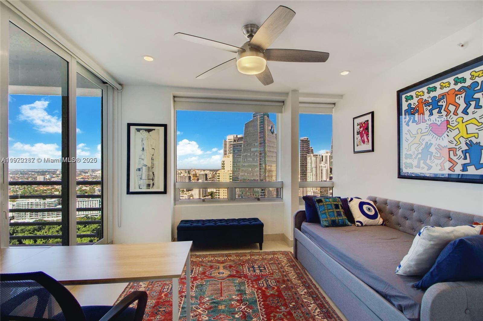 1541 Brickell Avenue, Unit A3902 Miami, FL 33129 - Photo 11 of 24 a living room with furniture and a large window