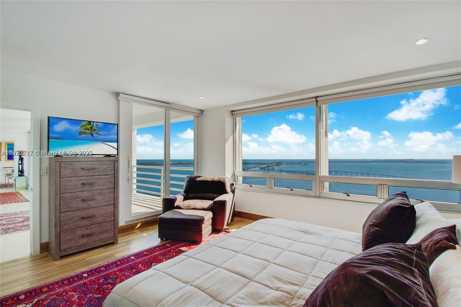 1541 Brickell Avenue, Unit A3902 Miami, FL 33129 - Photo 18 of 24 a bedroom with a large bed and a large window