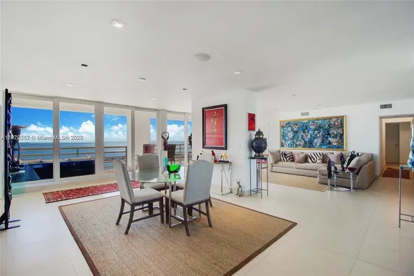 a living room with furniture and a table