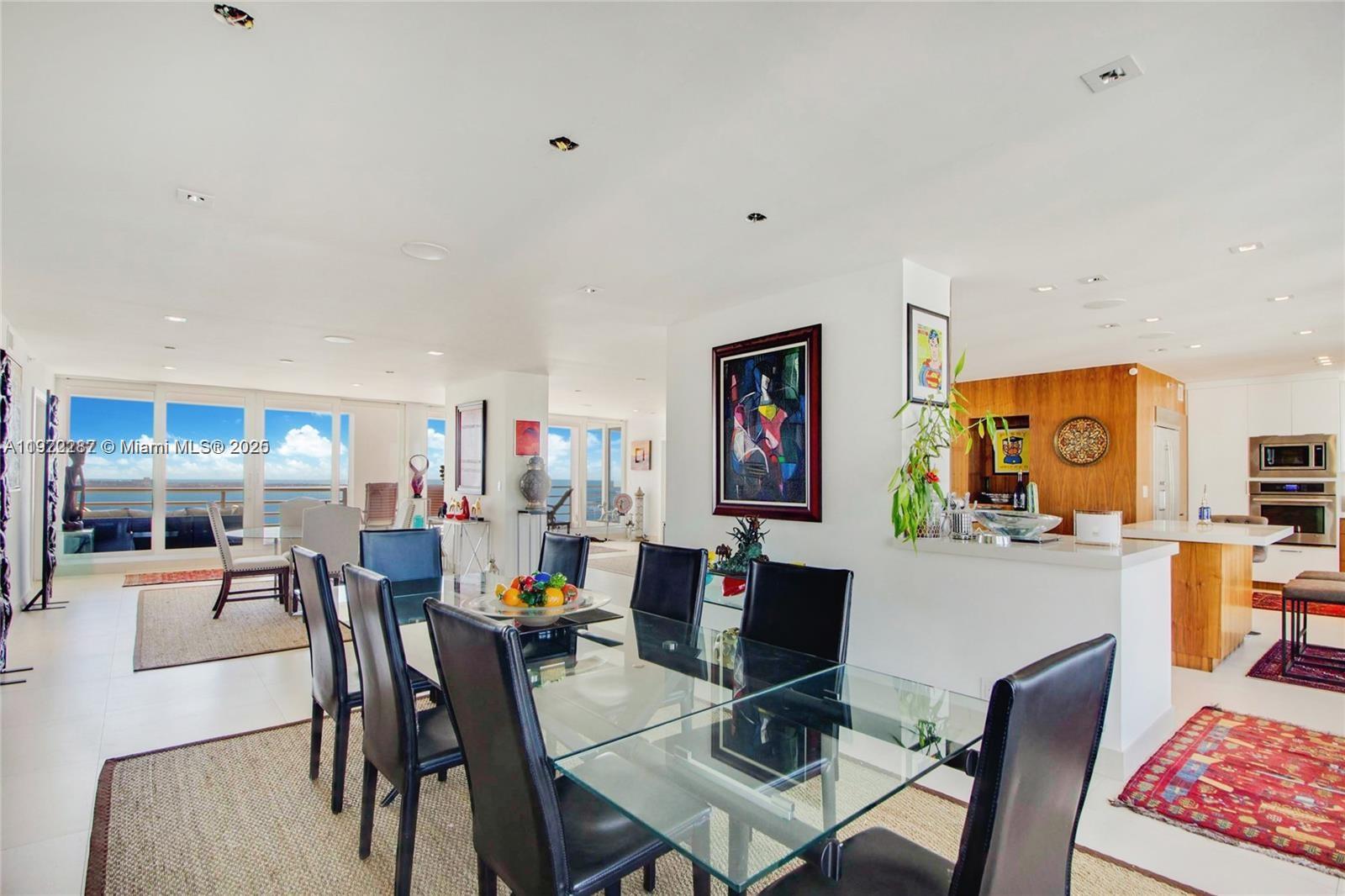 1541 Brickell Avenue, Unit A3902 Miami, FL 33129 - Photo 6 of 24 a view of a dining room with furniture